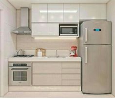 a kitchen with white cabinets and stainless steel appliances, including a silver refrigerator freezer