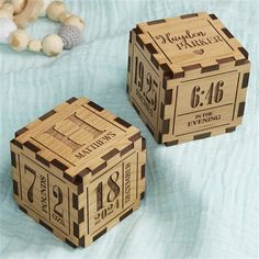 two wooden blocks with numbers and date on them