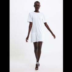 New With Tag. Outer Shell: 100% Polyester. Lining: 100% Polyester. Color: White Chic White A-line Pleated Dress, Casual Mini Dress With Pleated Hem For Daywear, Casual Knee-length Mini Dress With Pleated Hem, White Shift Midi Dress For Spring, White Pleated Hem Dress For Spring, White A-line Pleated Dress For Spring, White Pleated Mini Dress For Work, Casual Summer Mini Dress With Pleated Hem, White Pleated Mini Dress For Daywear