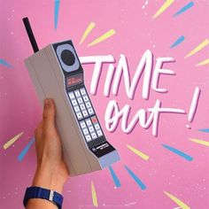 a hand holding a cell phone in front of a pink background with the words time out on it