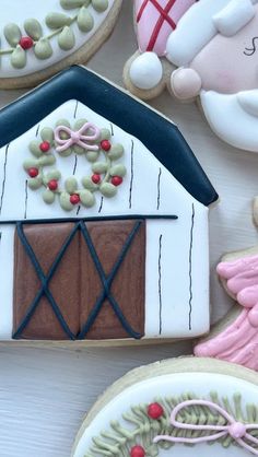 decorated cookies are displayed on a table