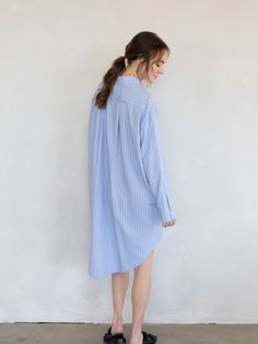 Pin striped button down shirt dress with side pockets! - Sizing: Model is 5'8", wearing a size S - Content: 70% Rayon, 30% Polyester Care: Handwash recommended Imported Striped Relaxed Fit Shirt Dress For Summer, Casual Striped Shirt Dress Relaxed Fit, Striped Long Sleeve Shirt Dress For Daywear, Striped Oversized Dresses For Daywear, Oversized Blue Shirt Dress For Day Out, Striped Long Sleeve Relaxed Fit Dress, Striped Long Sleeve Dress With Relaxed Fit, Oversized Striped Spring Dresses, Button-up Shirt Dress With Striped Collar For Work