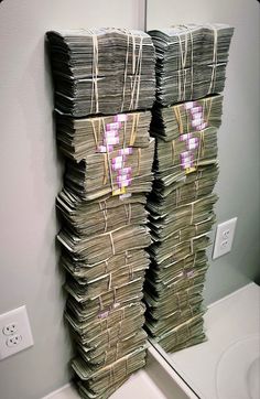 stacks of money are stacked on top of each other