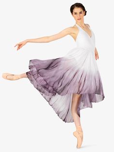 a woman in a white and purple dress is dancing with her arms spread out to the side