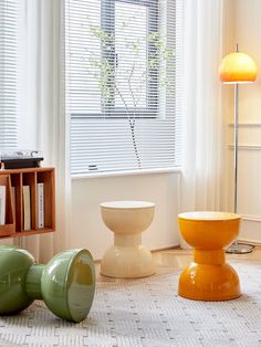 a living room filled with furniture next to a window