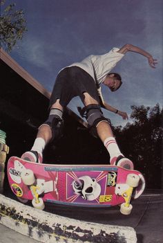 a man riding a skateboard up the side of a ramp