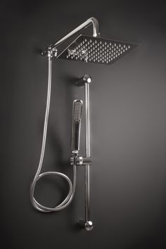 a shower head and hand shower with thermostaer attached to it's side