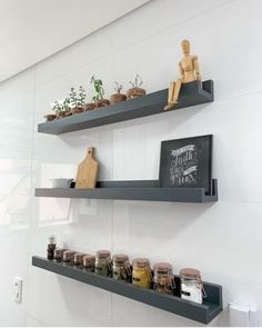 two shelves with spices and jars on them