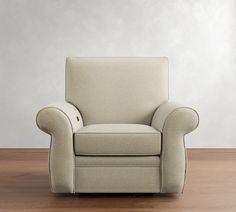 a white chair sitting on top of a wooden floor