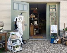 an open door to a shop with lots of stuff