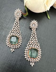 One of a kind Greenish stone rosegold diamond look earrings. The prasiolite look stone with cubic zirconia set in rosegold earrings. Premium quality product. Easy push back closure. ** P.S: non returnable product. Please ask any question if you have related to this product before purchasing as returns for size, color or weight etc are not covered. Buyer is responsible for return shipping cost in these cases. Rose Gold Diamonds, P S, Bridal Jewelry, Jewelry Earrings Dangle, Cubic Zirconia, Dangle Drop Earrings, Premium Quality, Dangle Earrings, Jewelry Earrings