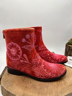 This is hand embroidery genuine leather custom made ankle boots.  Every size available.  There is 1 inches heel.  Round toe comfy shoes.  Custom made. İf you need wider calf measure please send us your calf measure from widest part.  Same boots but other style ( cowboy, platform etc. ) Please messages us.  Made with vintage suzani tapestry and genuine leather.   We have door to door express shipping.  İf you have any questions please contact with us.  bemyboots.etsy.com Thank You Red Bohemian Boots For Fall, Bohemian Red Leather Boots, Red Embroidered Boots With Round Toe, Embroidered Red Boots With Round Toe, Bohemian Leather Boots With Floral Embroidery, Red Embroidered Winter Boots, Bohemian Embroidered Boots With Round Toe, Bohemian Embroidered Round Toe Boots, Traditional Boots With Floral Embroidery And Round Toe