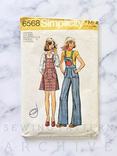 Simplicity 6568; ©1974; Young Junior/Teens' Short Jumper and Overalls: The top-stitched short jumper and the overalls with faced bib and suspenders fastened with front hook-up closure have back band, back zipper, shaped patch pockets and optional purchased applique. Featured in Simplicity Fashion News, September, 1974 Size 9/10  Bust 30.5 Waist 24  Hip 33.5  Envelope is in good vintage condition with some wear and wrinkling.  Pattern is cut to size 9/10 (30.5 bust), complete with instructions in Retro Bib Front Shortalls For Spring, Retro Spring Bib Front Shortalls, Retro Spring Overalls With Bib Front, Vintage Sleeveless Overalls With Pockets, Retro Fitted Sleeveless Pinafore Dress, Vintage Sleeveless Pinafore Dress With Pockets, Wide Leg High Waist Pants, Overalls Skirt, Simplicity Fashion