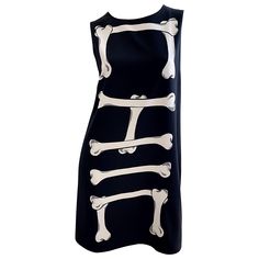 Amazing MOSCHINO Cheap and Chic early 2000s black and white novelty skeleton print dress ! Easy shift silhouette looks great on any shape. Soft lightweight rayon fabric that is fully lined. Hidden zipper up the back with hook-and-eye closure. The perfect little black dress that will surely be a conversation piece. Great for any day or evening event In great unworn condition Made in Italy Marked Size US 10 Measurements: 38 inch bust 37 inch waist 42 inch hips 36 inches from top back shoulder seam 2000s Black And White, No Bones About It, Skeleton Dress, Moschino Dress, Moschino Cheap And Chic, Skeleton Print, Perfect Little Black Dress, Overlay Dress, Dress Measurements