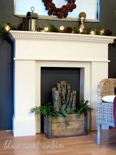 a living room filled with furniture and a fire place covered in wreaths on top of a mantle