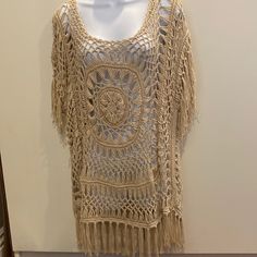 Tan Color M Handmade Design With Intricate Detail. Has The Same Design On Back. With Strong Dangles On Bottom And Sleeves. Beige Bohemian Open Knit Crochet Dress, Beige Crochet Dress With Crochet Trim For Festival, Beige Bohemian Crochet Top, Bohemian Knit Crochet Dress, Summer Knit Tops With Fringe, Summer Knit Top With Fringe, Bohemian Crochet Knit Top For Beach Cover-up, Bohemian Knit Tops With Fringe, Beige Knit Crochet Top For Beach