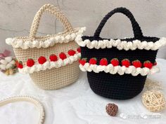 two crocheted bags sitting on top of a table