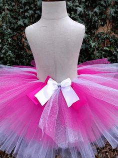 This Barbie Tutu Set, featuring a 100% cotton shirt and premium tulle in dreamy pinks and purples, is the perfect ensemble for your little princess! With its festive Barbie-themed colors, she'll feel the magic of her favorite character with every twirl. Make her day special with this beautiful tutu set! Colors are not set in stone and can be changed. Pink Fitted Cotton Tutu Dress, Cute Pink Cotton Tutu Dress, Pink Cotton Tutu Dress With Ruffles, Pink Cotton Cute Tutu Dress, Pink Cotton Tutu Dress For Parties, Barbie Tutu, White Tutu, Barbie Princess, Little Princess