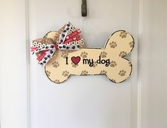 i love my dog bone door hanger with paw prints and a heart on it