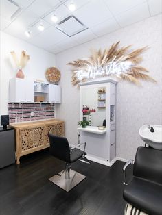 This hair salon studio in Murrieta, California has a white theme with a neon sign and accent wall to create a clean, modern feel. Salon Suite Ideas Accent Walls, Hair Studio Interior Design, Hair Salon Suites Decor, Lash And Hair Studio Ideas, Salon Suite Wallpaper Ideas, Black And White Salon Suite Decor, Black White And Gold Salon Suite, Beauty Salon Accent Wall Ideas, Modern Chic Salon