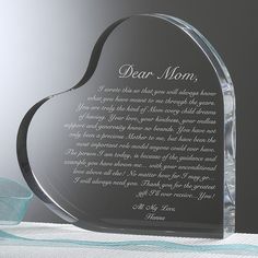 a glass heart shaped award with a poem on it