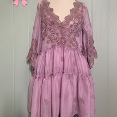 Please Note: This Dress Is A New Sample From The Free People Sample Sale. No Care Label Or Size Label Is Attached. It Is Not Yet Available In Store. Name Of Dress Is Chrysanthemums Mini. Size Listed As Xs But Could Fit A Small. Please See Measurements Below. Content: 100% Polyester Color: Lilac Rose Cream Comes With Slip Dress Tie Sleeve Babydoll Style Embroidered V Neck Tiered Ruffles Cinched Bell Embroidered Sleeve Measurements: Bust: 34” Length:32” Purple Lace Patchwork Summer Dress, Summer Purple Lace Patchwork Dresses, Summer Purple Dresses With Lace Patchwork, Pink V-neck Mini Dress With Floral Embroidery, Purple Lace Patchwork Dress, Fitted Lavender Embroidered Dress, Pink Floral Embroidered V-neck Mini Dress, Pink Floral Embroidery V-neck Mini Dress, Lavender Floral Embroidered Dress For Spring