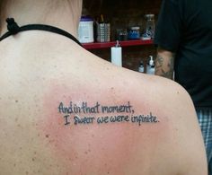 a man with a tattoo on his back saying anything that moment, i swear we were infinite