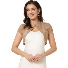 An elegant stand collar and short sleeves make this beautiful lace cardigan a great outfit for any occasion. This lace bolero is perfect for a wedding dress. Team it with a sleeveless dress and a mini bag to complete the elegant look. Lend an understated detail to your formal ensemble with this cropped bolero. This shrug can be paired with many suspender dresses to perfect your outfit. Short Sleeve Bolero, Cropped Shrug, Lace Shrug, Lace Bolero, Lace Cardigan, A Wedding Dress, Lace Neckline, Suspender Dress, Celine Dion