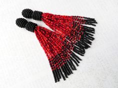 Red Beaded Tassel Drop Earrings, Red Beaded Earrings With Tassels And Round Beads, Red Beaded Earrings With Tassels, Red Beaded Dangle Earrings With Tassels, Red Beaded Fringe Tassel Earrings With Round Beads, Red Beaded Fringe Tassel Earrings, Red Tassel Earrings With Beaded Fringe, Red Fringe Tassel Earrings With Round Beads, Red Tassel Earrings With Fringe And Round Beads