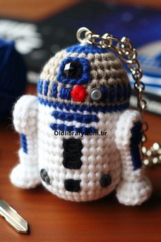 a crocheted star wars character keychain on a table