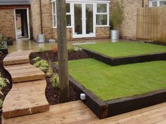 an outdoor area with grass and steps