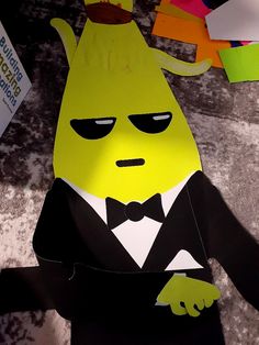 a paper cut out of a cartoon character wearing a tuxedo and bow tie