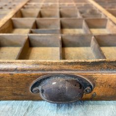 an old wooden drawer with many drawers in it