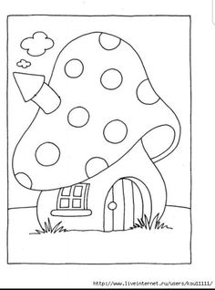 a mushroom house that is in the grass