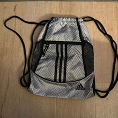 Adidas Draw String Bag, Brand New. Front Zipper Pocket And Mesh Pockets On Both Sides, Holds 2 Water Bottles Great For Traveling. Gray Zipper Closure Pouch Bags, Casual Gray Backpack For Sports, Casual Gray Sports Backpack, Gray Sports Bags With Zipper Closure, Sporty Adidas Bag With Zipper Closure, Sporty Gray Rectangular Bag, Rectangular Adidas Bag For Everyday Use, Adidas Rectangular Bag For Everyday Use, Adidas Sporty Gym Bag For Daily Use