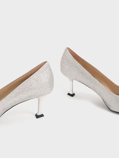 If you are trying to get your look just right for your next wedding invite, it will come easy with the help of these delightful glitter pumps. From the gem-encrusted embellishment in a square-shaped motif to the sleek metallic sculptural heel, these shoes easily deliver a modern edge to your opulent ensembles. Channel sophistication when you don these stunning pumps with a beaded bodice mini dress and complete your outfit with a sculptural clutch — now you are all set for your picture-perfect big day. Glitter Pumps, Silver Pumps, Beaded Bodice, Kitten Heel Pumps, Charles Keith, Wedding Invite, Heel Pumps, Kitten Heel, Picture Perfect