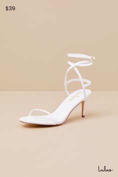 The sexy vibes of the beloved Lulus Sydd Ankle Wrap High Heel Sandals just got a comfy upgradeâ€”the Lulus Sydd White Ankle Wrap Low Heel Sandals! Smooth faux leather shapes these must-have heels that feature a single sole silhouette with an almond-shaped footbed and a slender toe strap. Matching straps sprout from the sides to wrap and secure around the ankle with a gold buckle, all atop a low, stiletto-style heel! 2. 75" stiletto heel. Lightly cushioned insole. Rubber sole has nonskid markings Ankle Wrap Sandals, Low Heel Sandals, Wrap Sandals, Almond Shaped, Sandal Heels, Ankle Wrap, Heel Sandal, Heel Sandals, High Heel Sandals