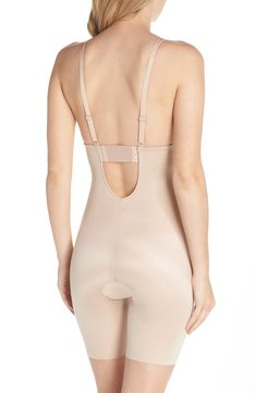 The ultimate low-back, low-front solution for when you’re getting glam, this bodysuit of sleek shaping fabric has adjustable and convertible straps. Style Name:Spanx Suit Your Fancy Plunge Low-Back Mid-Thigh Bodysuit. Style Number: 5582864. Elegant Backless Shapewear With Built-in Bra, Elegant Second-skin Bodysuit With High-cut Leg, Elegant Second-skin High-cut Leg Bodysuit, Sleek Bodysuit With Low Back And Moderate Coverage, Elegant Second-skin Backless Bodysuit, Elegant Sculpting Backless Bodysuit, Elegant Stretch Bodysuit With Back Opening, Elegant Fitted Bodysuit With Back Opening, Elegant Shaping Bodysuit With Low Back