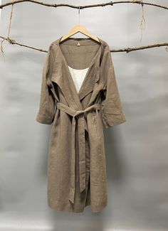 "A super versatile and multifactional open front knee length cardigan/jacket to keep you warm and chic. 100% linen construction, loose and stylish, comfy and easy to throw on with any outfit. A timeless piece made for many kinds of weather and occasions. - 100% Medium weight linen - Open front with removable belt - Knee length - Two side welt pockets - Bracelet sleeves Please provide your shoulder width, full bust measurement ( measured around the fullest part) and your height in the note to sel Summer Open Front Solid Color Outerwear, Solid Outerwear For Summer Layering, Long Sleeve Solid Color Summer Outerwear, Solid Summer Outerwear For Layering, Solid Color Summer Outerwear For Layering, Long Solid Summer Cardigan, Long Solid Color Outerwear For Daywear, Casual Solid Outerwear For The Beach, Casual Solid Color Outerwear For Beach