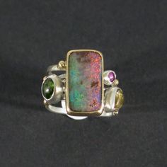 Tourmaline & opal swirled gold silver ring, Four stone band ring Unique Opal Rings With Gemstone Accents, Unique Multicolor Opal Gemstone Ring, Unique Multicolor Cabochon Opal Ring, Multicolor Opal Multi-stone Rings, Unique Opal Ring With Gemstone Accents, Unique Multi-stone Opal Rings, Cabochon Rings, Boulder Opal Jewelry, Modern Rings