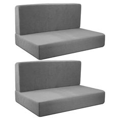 two gray couches sitting next to each other