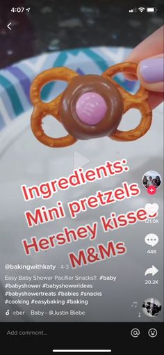 someone is holding a toy in their hand with the words ingredients mini pretzels hershey kisse mms