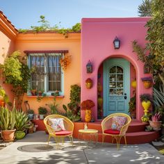 an outdoor patio with chairs, potted plants and pots on either side of the house