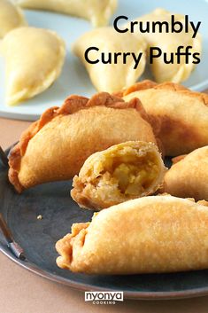 crumbly curry puffs on a black plate