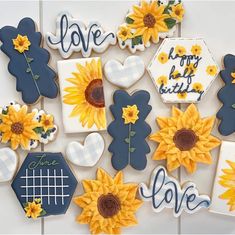 decorated cookies with sunflowers and love written on them are arranged in the shape of hexagons