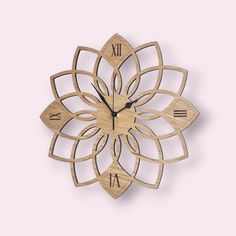 a clock made out of wood with roman numerals