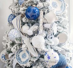 a christmas tree with blue and white ornaments