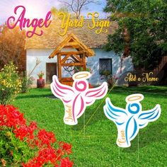 an angel yard sign in front of a house