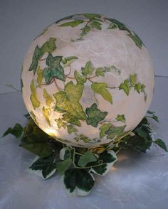 a white ball with green leaves on it