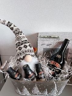 a basket filled with beer bottles and gnome hats